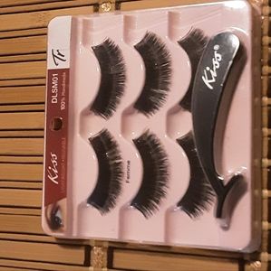 New unused Kiss hand made Femme lashes with Twizzer applicator.  Black lashes